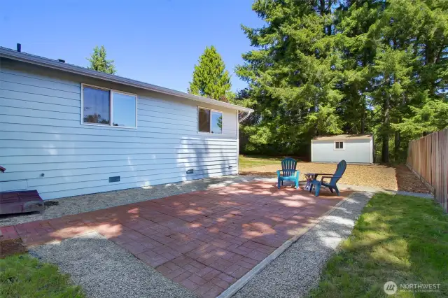 Flat and level with well-installed brick-look pavers. The gravel surround makes lawnmowing easier--and cuts down on the edging!