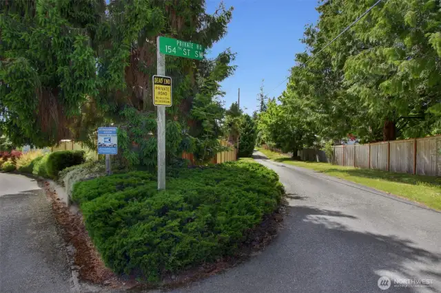 This sign shows that 154th Street SW is a Private Road. Please see Title report for maintenance and ownership.