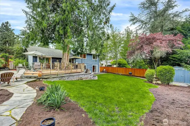 Deck and patio, perfect for entertaining.  Stone path to firepit.