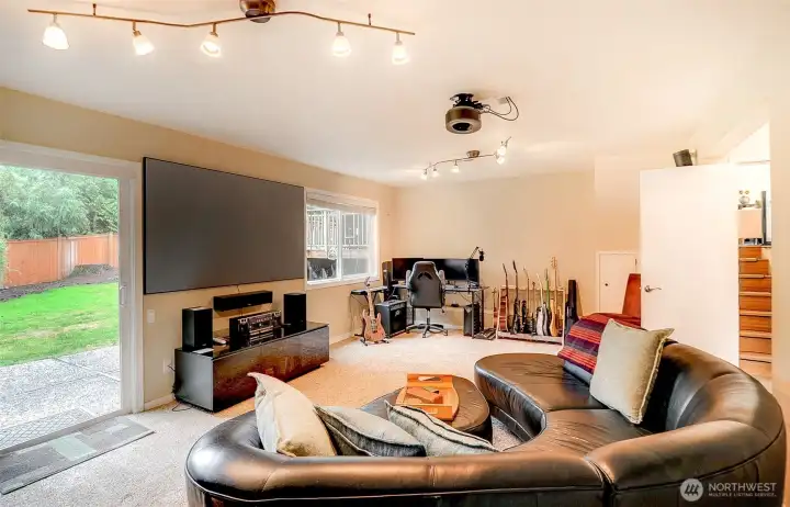Daylight basement family/theater room with built in projector included.