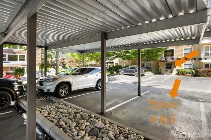 Parking space 163, the furthest spot to the right in photo, is just outside the main entrance to the building.