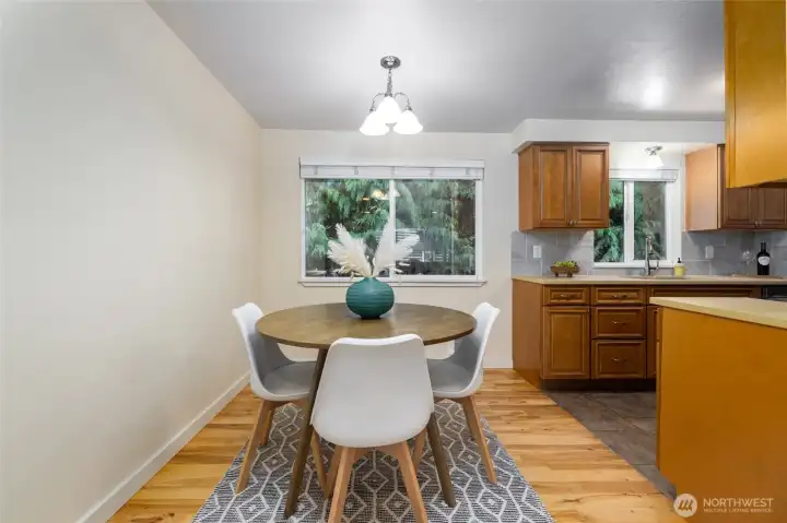 looking from the living room to the dining and kitchen area.