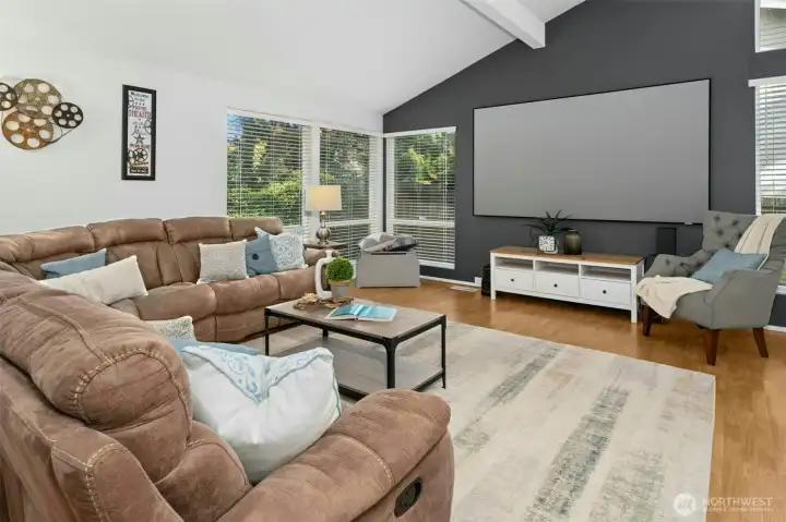 Spacious living area featuring a 110-inch projector screen for relaxing or movie nights.