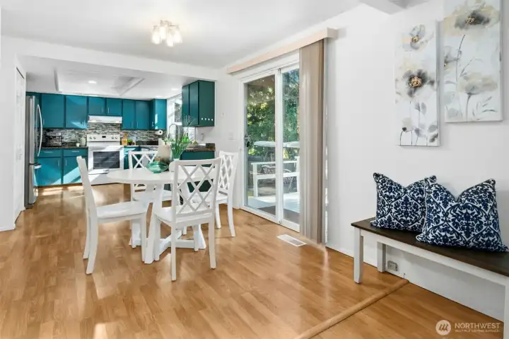 Bright dining nook opens to the deck and backyard.