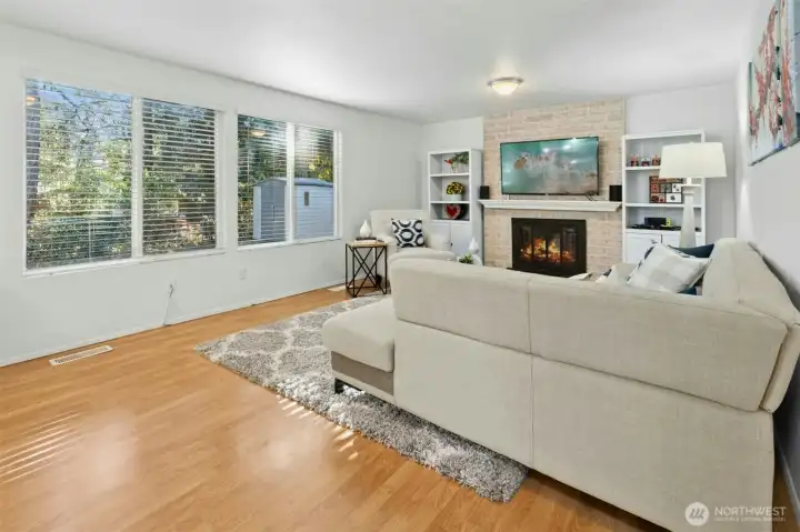 Cozy family room with a brick fireplace.