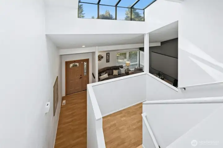 Dramatic skylight fills the entry with sunshine.