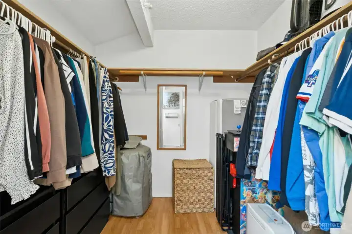 Spacious walk-in closet with ample storage.