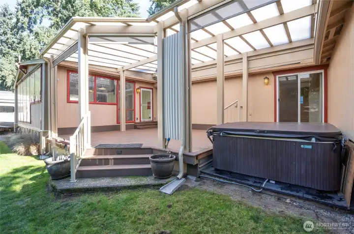 Enjoy outdoor entertaining anytime of the year on the covered Trex deck with hot tub.