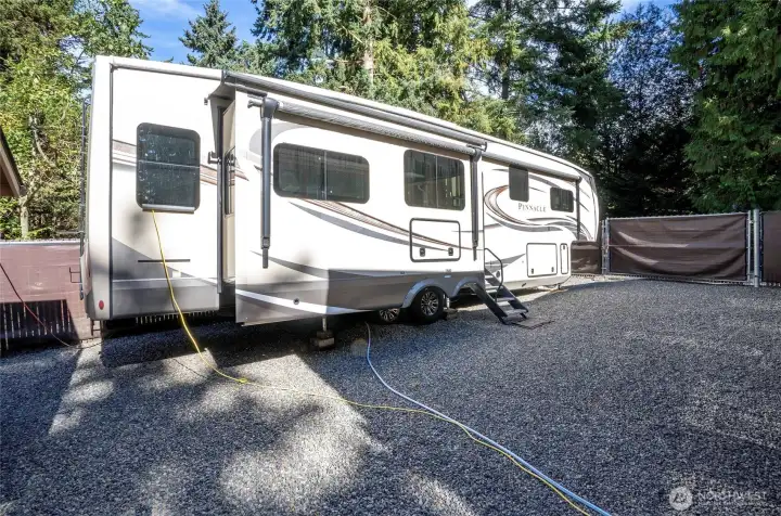 Secure gated RV and toy parking right beside the detached garage!