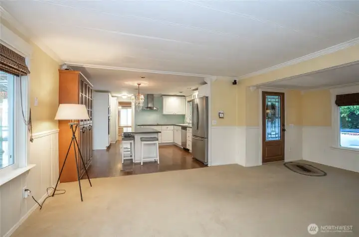 Open living and dining space overlooking the stunning remodeled kitchen.