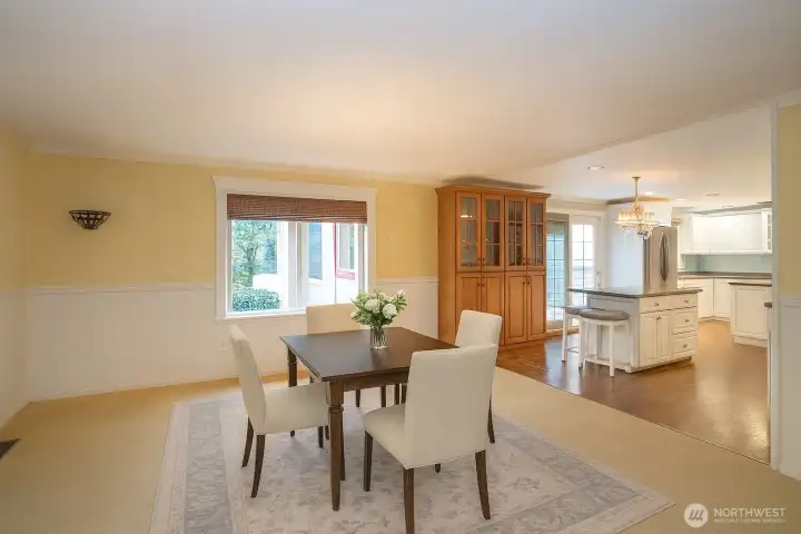 Dining area by the kitchen, virtually staged to inspire.