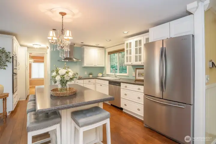 Cook in style! The remodeled kitchen with beautiful cabinets is sure to inspire your inner chef.