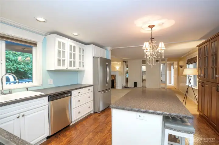 From the kitchen, take in the open layout connecting the dining and living areas.