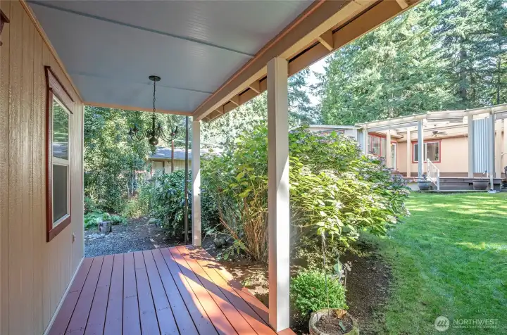 Enjoy the covered porch of the studio/flex space overlooking the main home.