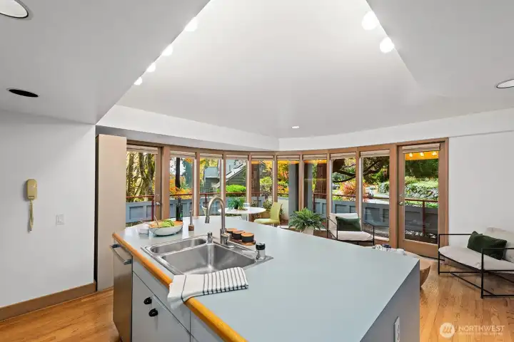 Kitchen with vaulted ceilings and large island is great for prepping food and entertaining guests.
