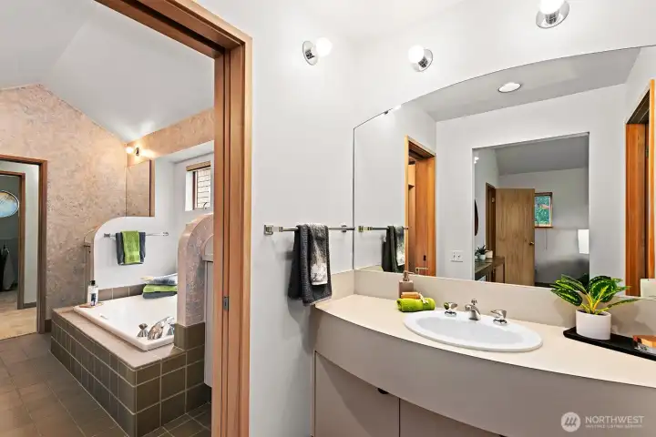 Jetted tub and separate shower between the bedrooms.