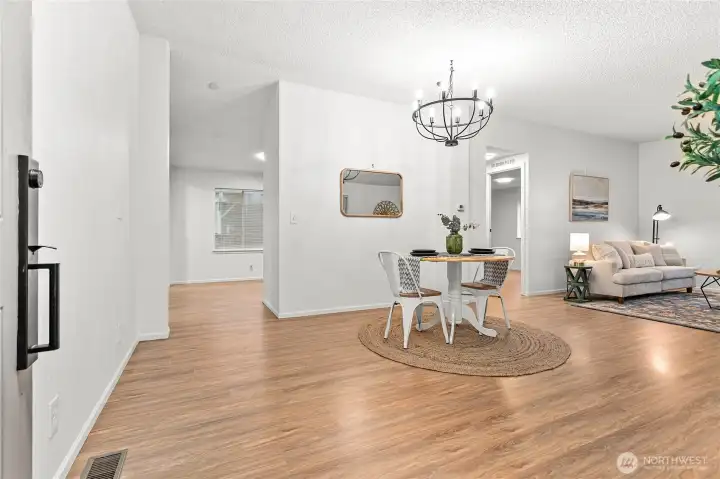 Pretty laminate wood flooring & fresh paint throughout