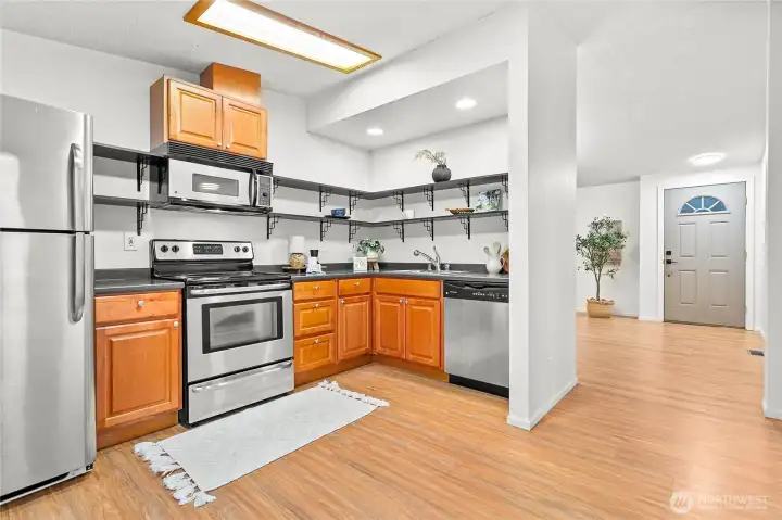 Open kitchen w/stainless steel appliances