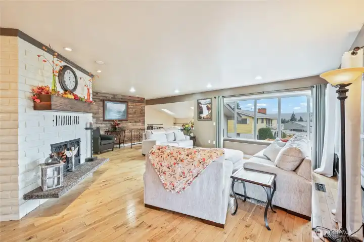 Living space, double sided fireplace and hardwood floors - upper level