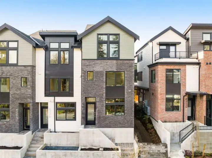 Modern architectural design with sleek lines and large windows, offering incredible curb appeal in a prime location.