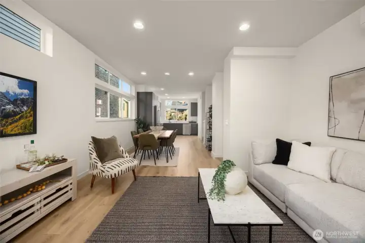 Bathed in natural light, this versatile great room offers plenty of space for oversized furniture and artistic decor.