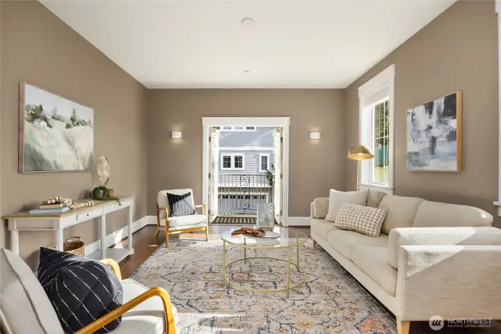 Double doors in the den open to a private Juliet balcony.