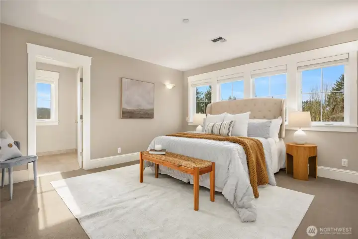 Second upper-level bedroom suite functions as a second primary suite featuring a deep closet (not shown) and ensuite bathroom.