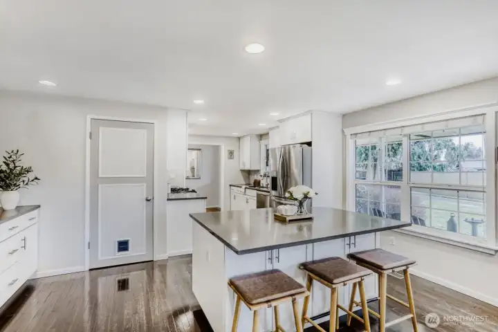 Kitchen island with door to basement utility room