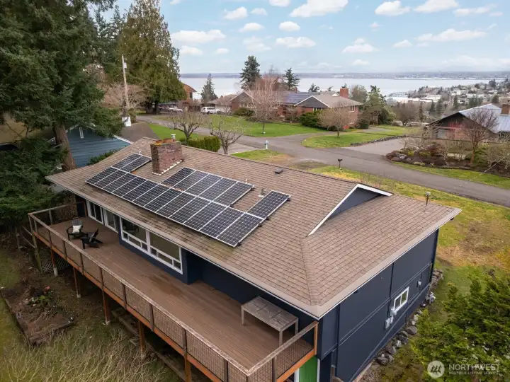 The Hardiplank siding was placed just a few years ago, as were the vinyl windows and solar on the composition roof. There is an expansive deck that is the full width of the home on the back off the dining room and garage.