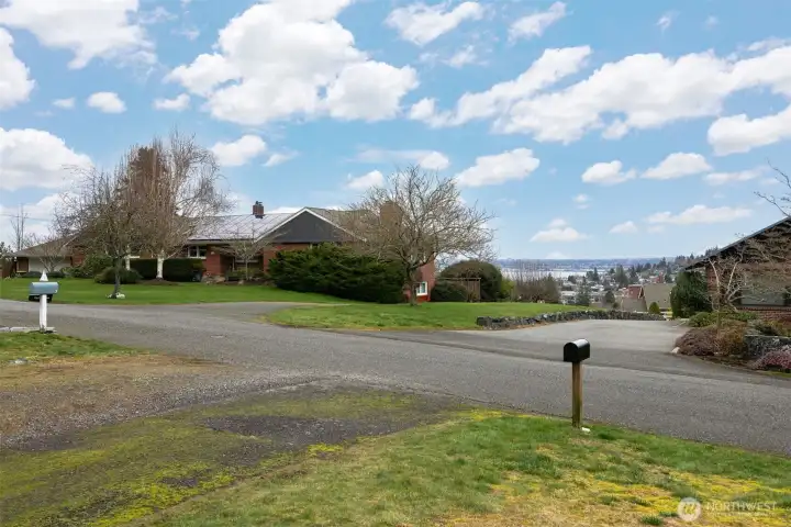 The views from the front of the home are stunning, and there is a large level front lawn and driveway.