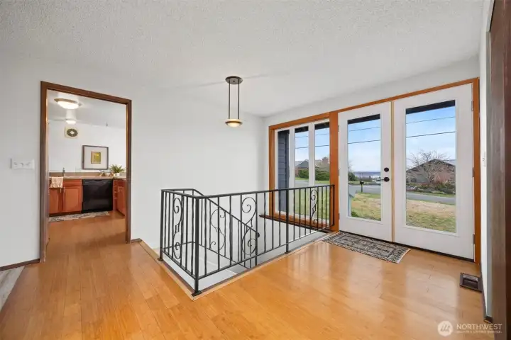 The entry is welcoming and opens to the kitchen, dining and living areas.