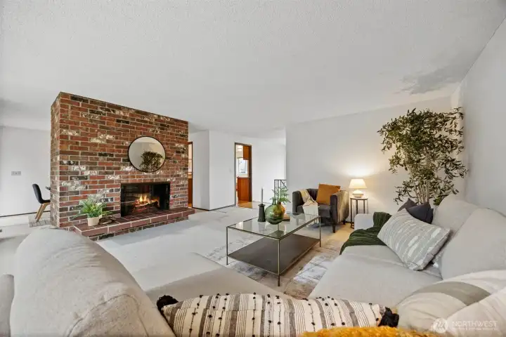 Another view of the living looking toward the front entry and the kitchen beyond.
