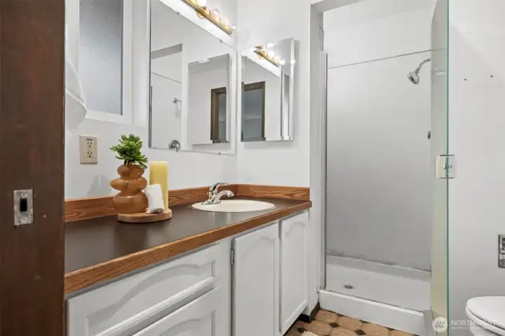 The 3/4 bath off the primary suite.