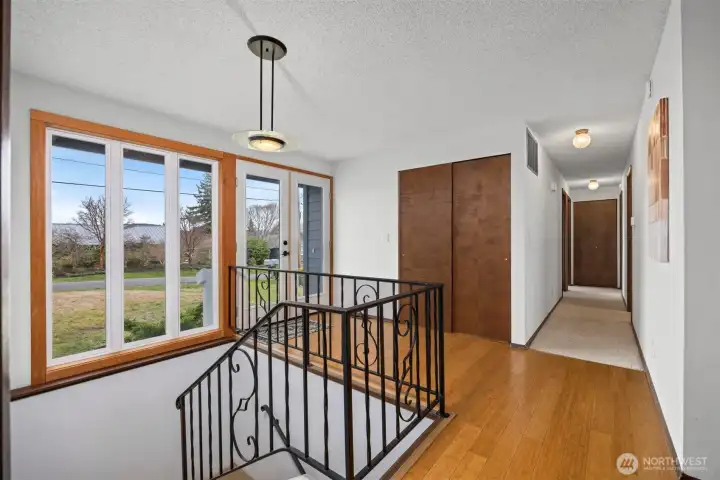 From the front entry you look down the hall where the beds and baths are on the main floor.