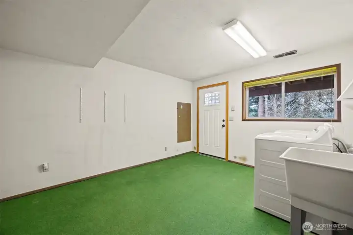 The laundry room has an abundance of room and this room could be redone into another livable space.