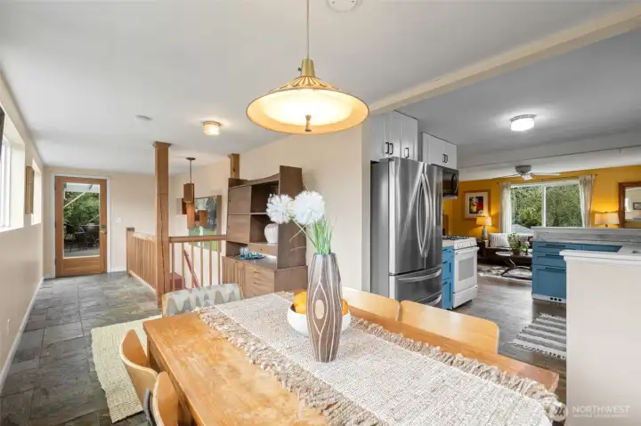 The dining room has space for a hutch and an open stairwell down to the lower level or flow outside to the huge covered patio, fit pit and more!