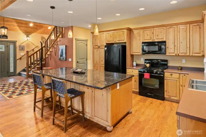 Thoughtfully designed with abundant cabinetry, ample counter space, and an easy, functional layout for cooking and hosting.
