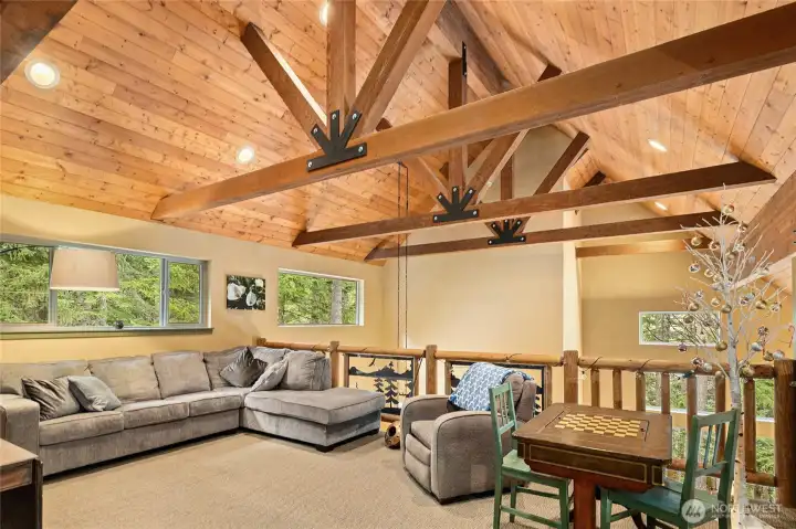 Versatile loft space overlooking the great room below, offering an open, airy feel with excellent natural light—ideal for a home office, reading nook, or additional lounge area.