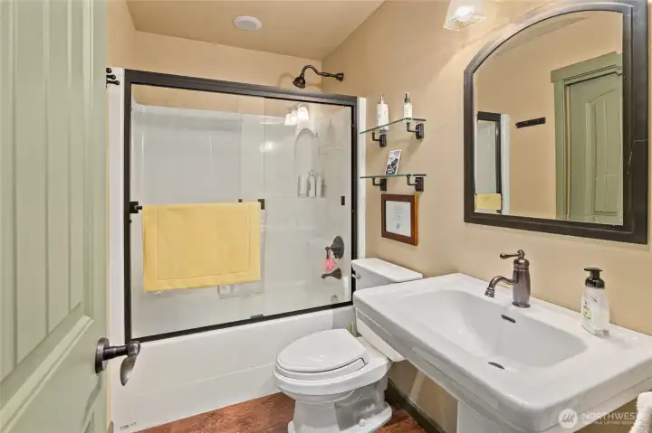 Thoughtfully designed shared full bath on the upper level, providing comfort and functionality for family or guests.