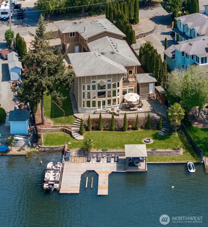 Welcome to this exquisite 3985 sq ft custom home on 92' of no bank waterfront. Large U shaped boat dock, gazebo + jet ski ramp.