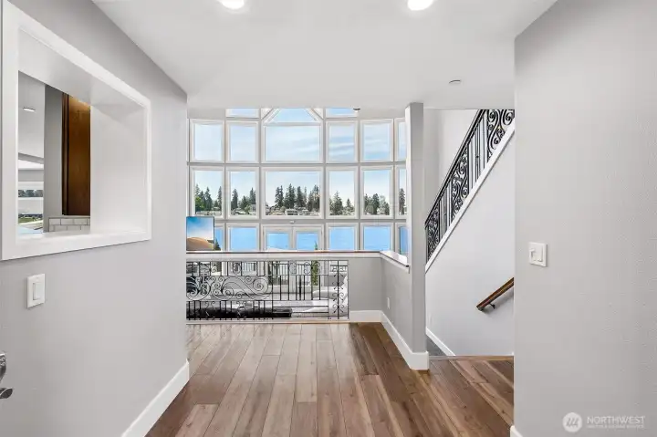 From the moment you step through the front door, you’re greeted with stunning water views that immediately set a serene and captivating tone for the home.