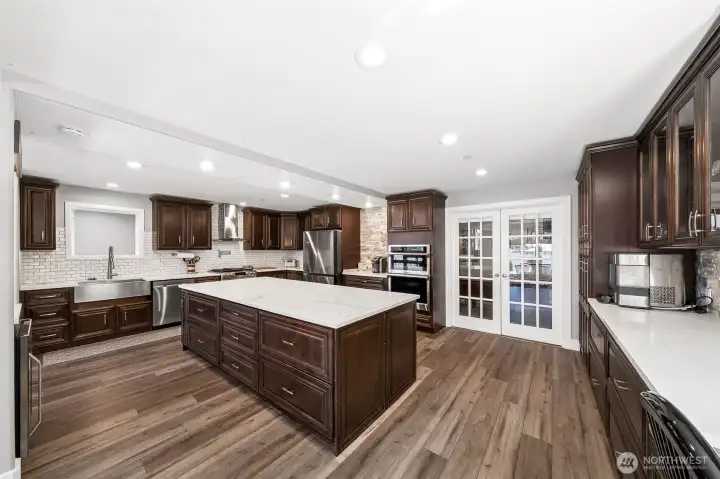 Gourmet kitchen is a chef’s dream, perfect for entertaining with top-of-the-line appliances, ample counter space and tons of cabinets for storage!