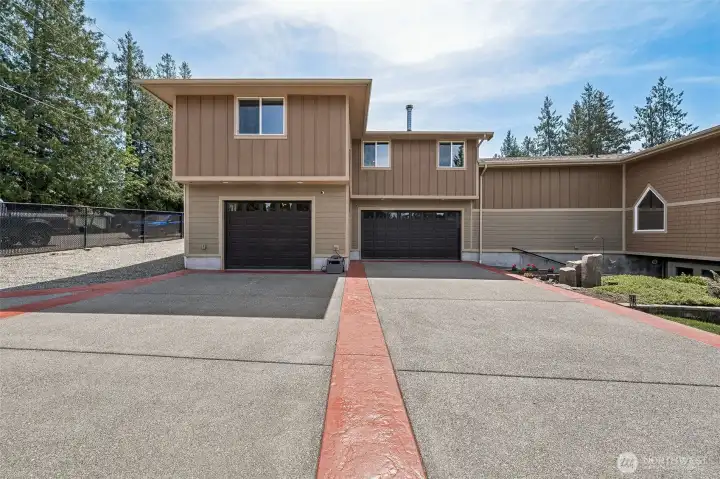 Large flat driveway allows for ample parking, extra storage for the boat trailer or XL RV- your choice?