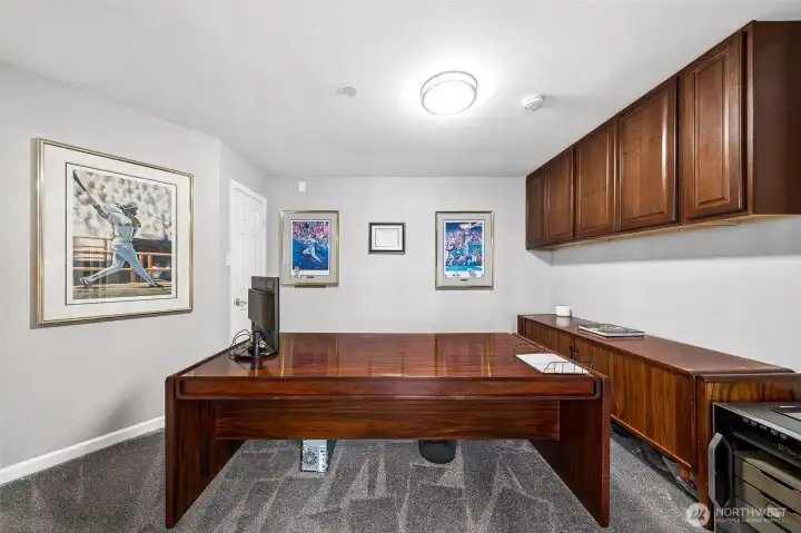 Main floor Jr. Suite with built in cabinets- could be used as office with attached full bathroom.