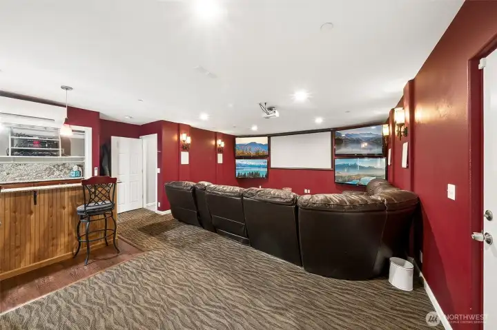 Main floor theatre room built in bar + 5 TV's for that special game nights with friends.