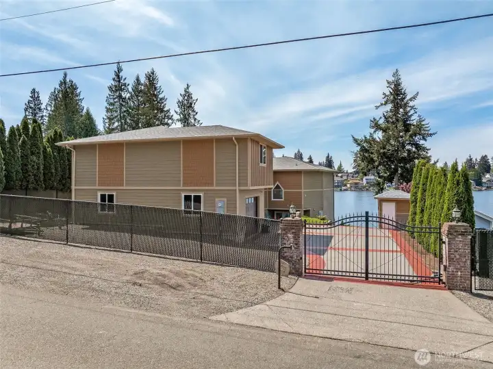 Private automatic gate offers secure access. RV & boat parking just inside the gate or additional parking outside the gate.