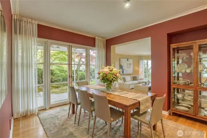 Dining room with french doors to courtyard, virtually staged Dining room with french doors to courtyard, virtually staged