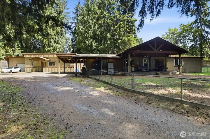 Long driveway leads to both homes, property is fully fenced.