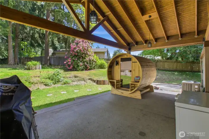 Covered patio overlooks backyard