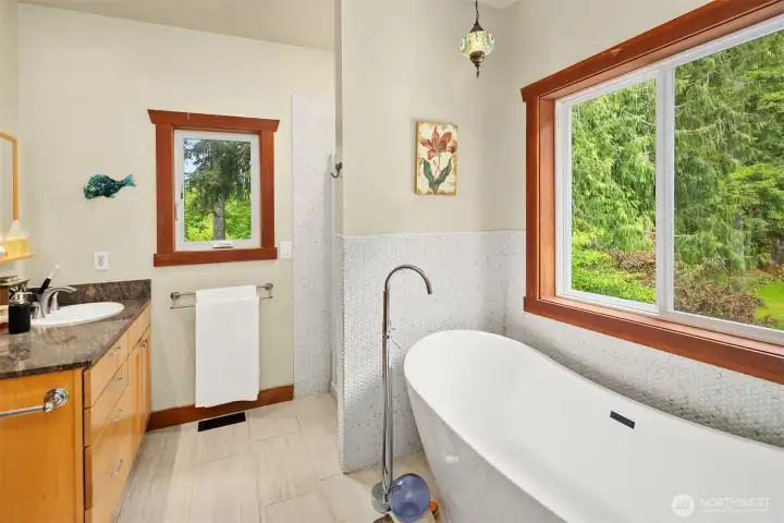 Completely remodeled primary bathroom – tile flooring, granite his and her vanity, large, tiled shower. (2021)
